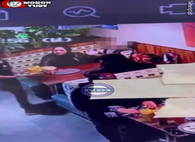 Video :For no apparent reason, he strikes a server with a dish, yet the cops release him
